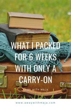 an old suitcase with books on top and the words what i packed for 6 weeks with only a carry - on