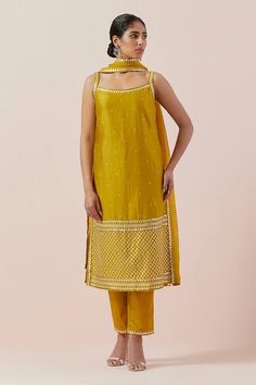 Mustard yellow kurta with aari, sequin and zari work in chanderi base. Paired with a cotton pant and silk organza dupatta with silver and gold hand embroidery. - Aza Fashions Yellow Dupatta, Yellow Kurta, Kurta Pant Set, Zari Work, Organza Dupatta, Gold Hand, Kurta With Pants, Silk Organza, Gold Hands