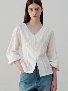 This is a comfortable and trendy top by ourcomos that is made out of high quality cotton 100% fabric. With refined design detail with trendy look, it will stand out from your casual and feminine daily outfit.- Shirring detail on the chest and sleeve- Sea shell buttons on the front- Strap detail on the waist Relaxed Fit Cotton Blouse For Daywear, Feminine Cotton V-neck Blouse, Chic Long Sleeve Cotton Blouse, Classic Cotton V-neck Shirt, Classic V-neck Cotton Shirt, Classic Everyday Spring Tops, Chic Everyday Cotton Shirt, Feminine Cotton Long Sleeve Blouse, Feminine Relaxed Fit V-neck Tops