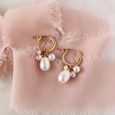 Introducing the Verona Pearl Hoops: handcrafted stunners that'll make you look and feel like a goddess! Perfect for elevating any outfit, these delicate and oh-so-lovely hoop earrings feature a cluster of freshwater pearls that will bring a little luxe to your look. So, take a pearly dive in and show off your style! Make it a set with our matching Verona Pearl Necklace. Handcrafted to order in our Salt Lake City studio ✨ DETAILS Made with freshwater pearls. Available in 14k Gold Filled or Sterli Bohemian Hoop Earrings For Celebrations, Delicate Handmade Bridal Earrings, Handmade Small Hoop Pearl Earrings, Teardrop Bridal Earrings For Celebrations, Handmade Dainty Hoop Earrings For Wedding, Dainty Handmade Hoop Earrings For Wedding, Handmade Small Hoop Earrings For Wedding, Celebration Teardrop Hoop Earrings, Celebration Dangle Pearl Earrings