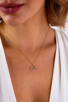 "This 14K gold lotus necklace is the perfect gift for anyone who loves yoga, meditation, or floral-inspired jewelry. The lotus flower is a symbol of enlightenment, purity, and rebirth, making it a meaningful and spiritual choice for a necklace. The gold finish adds a touch of luxury to this piece, making it a beautiful addition to any outfit. This necklace would make a thoughtful gift for a mom, or for any occasion including Christmas, Father's Day, Mother's Day, Valentine's Day, anniversaries, Spiritual Lotus Flower Necklace For Meditation, Flower Necklace Gold, Lotus Flower Necklace, Yoga Necklace, Lotus Necklace, Gold Lotus, Gold Armband, Gold Anklet, White Gold Necklaces