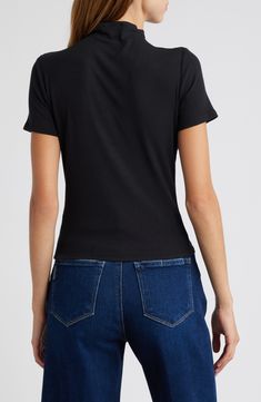 Made from soft and stretchy jersey, this figure-hugging top has a chic mock neck that elevates the look of any outfit. 20 1/2" length (size Medium) Mock neck Short sleeves 95% modal, 5% spandex Dry clean or machine wash, dry flat Imported Sleek Black Mock Neck Top, Sleek Black Turtleneck Top, Casual Turtleneck Top In Elastane, Black Stretch Mock Neck Top, Versatile Fitted Black Mock Neck Top, Chic Fitted Black Mock Neck Top, Spring Black High Stretch Mock Neck Top, Black High Stretch Mock Neck Top For Spring, Chic Black Fitted Mock Neck Top