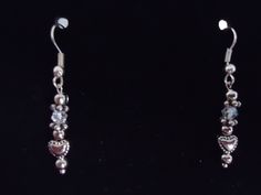 This pair of silver metal dainty hearts and clear glass bicone beads with silver plated beaded rondelles and silver plated beads and silver plated ear wires. They are 1 5/8 inches long. Beaded Heart, Bead Earrings, Ear Wires, Silver Beads, Beaded Earrings, Favorite Jewelry, Clear Glass, Jewelry Earrings Dangle, Metallic Silver