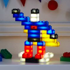 a lego lite up toy standing on top of a table