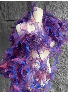 a mannequin with purple ruffles on it