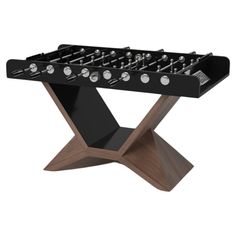 a black foosball table with wooden legs and metal knobs on the top