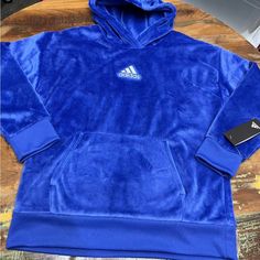 Soft, Warm And Fuzzy Adidas Hoodie. Front Pouch Pocket. Bright Blue. Adidas Size 14 Large Blue Hooded Fleece Outerwear, Blue Sportswear Sweatshirt For Winter, Blue Fleece Sportswear Outerwear, Cozy Blue Hoodie Outerwear, Blue Sports Hoodie With Fleece Lining, Blue Fleece Hoodie For Winter, Blue Hoodie With Drawstring For Cold Weather, Blue Fleece Outerwear With Drawstring Hood, Cozy Blue Fleece Sweatshirt