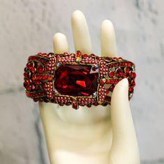 *Red Rhinestone Oval-Shaped Cuff Hinge Bracelet *Never Worn *No Missing Stones: Last Picture Shows Glue Dots On Backside Center Of The Bracelet To Hold Center Stone (Cannot See When Worn) *Weighs 2 1/2 Ounces Hinge Bracelet, Crystal Belt, Hinged Bracelet, Glue Dots, Red Rhinestone, Womens Jewelry Bracelets, Oval Shape, Lady In Red, Hinges