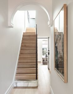 a staircase leading up to a living room