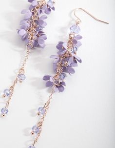 Flower power! These lovely lilac drops will draw all eyes to you! They boast an impressive drop and pretty petal details on a gold-toned setting. Pair them with gold-toned accessories for a glam look, or layer them with pastel tones.  Product Details:    Composition: Gold-toned metal earrings with plastic beads.  Colour: Lilac and gold Style: Pastel Dreaming Occasion: Out for breakfast, lunch or dinner? These versatile beauties suit all three!  Care: Avoid direct contact with water, moisturiser Lovisa Jewellery, Fashion Jewellery Online, Flower Cluster, Glam Look, Bold Earrings, Glam Looks, All Eyes, Stunning Earrings, Purple Flower