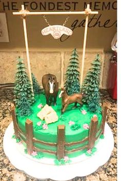 a cake decorated with green frosting and trees