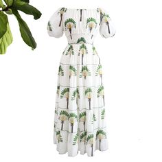 Our iconic Happy Dress combines timeless design with effortless wear. Featuring an elastic waist, elasticized neckline for off-the-shoulder style, and elastic cuffs for tailored shape, it is made from pure soft cotton and delicately adorned with an all-over print of fabulous Travellers Palms. Cotton Dresses With Elastic Shoulders, Elegant Off-shoulder Cotton Midi Dress, Spring Cotton Dress With Elastic Shoulders, Vacation Dress With Elastic Sleeves, Cotton Off-shoulder Dress For Daywear, Summer Fitted Off Shoulder Dress With Gathered Sleeves, Fitted Dress With Elastic Sleeves For Vacation, Fitted Maxi Dress With Gathered Sleeves For Vacation, Fitted Off Shoulder Dress With Gathered Sleeves For Summer