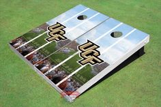 a pair of cornhole game boards on the grass