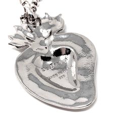 Based on a DelBrenna family design, our Flaming Heart pendant represents our passion for our craft. We love beauty, fashion, and sharing our creativity with you. This pendant calls you to open your heart and share your wonderful self with the world! Pendant in 925 silver with DelBrenna’s Signature Rhodium Finish. It is 2 1/4” in height and 1 1/2” wide. Its bail slides onto all DelBrenna chains up to 5mm. Chain sold separately. Unique Silver Necklaces For Valentine's Day, Unique Silver Heart Necklace For Gift, Unique Silver Necklace For Valentine's Day, Luxury Silver Heart Necklace With Heart Charm, Unique Silver Heart Pendant Necklace, Luxury Silver Heart Necklace Gift, Luxury Sterling Silver Heart Pendant Necklace, Unique Silver Heart Charm Necklace, Silver Polished Heart Pendant Necklace