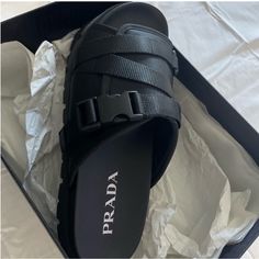 Brand New Black Prada Sandals Men’s 10 Luxury Black Slides With Buckle Closure, Designer Black Slides With Buckle Closure, Modern Black Slides With Buckle Closure, Black Leather Sport Sandals With Buckle Closure, Designer Leather Slides With Textured Footbed, Designer Black Leather Slides, Black Designer Leather Slides, Black Leather Sport Sandals With Leather Footbed, Designer Leather Sandals With Textured Footbed