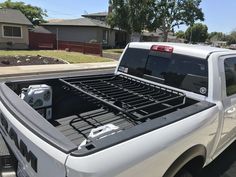 a white truck parked in front of a house