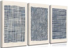 three blue and white abstract paintings on canvases, each with different designs in the same pattern