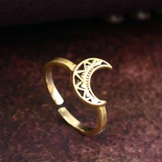 Gold Half Moon ring, Crescent Moon Ring, Mandala Moon Ring, Stacking Ring, Luna Ring, Minimalist Ring, Dainty Ring, Adjustable Boho Ring Metal:- Brass ✦ Our rings are made of high-quality Brass metal and are carefully crafted by hand in our family workshop. The brass metal will develop a nice antique color over time. So, I suggest cleaning it once in a while for getting back to the shiny original color. You can use natural ingredients like lemon or vinegar with water to clean it. Also, apply a thin coat of transparent nail paint/nail enamel on the ring's inner side to save it from being tarnished. ❥ You may request to return the products, 15 days after you received the items (Delivery Day). The buyer is responsible for the shipping costs for the return. (We may have slower production at ho Minimalist Adjustable Crescent Ring, Minimalist Adjustable Rings With Moon Charm, Adjustable Rings With Moon Charm, Minimalist Adjustable Ring With Moon Charm, Moon Phase Midi Rings As A Gift, Adjustable Gold Midi Rings With Moon Shape, Adjustable Gold Moon Midi Rings, Adjustable Moon-shaped Midi Promise Rings, Bohemian Moon Phase Ring