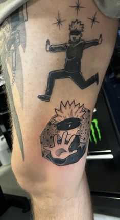 a man with a tattoo on his leg that has an image of a person jumping in the air