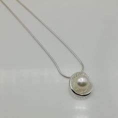 ▪︎ An elegant pendant made with a pearl on a sterling silver base. ▪︎ Size: 12 mm x 18 mm. Pearl size: 10mm Weighs: 3 gm ▪︎ This multi purpose pendant can be used as a charm in necklaces, bracelets, key chains, zip pullers etc. ▪︎ This pendant is handmade with hypoallergenic sterling silver. Most of my pieces are marked with a 925 silver stamp. ▪︎ Please note: This listing is for ONE pendant and comes WITHOUT the chain, however, you can add a snake chain in the required length while making your Egyptian Necklace, Silver Charm Necklace, Tibetan Jewelry, Silver Eye, Charm Necklace Silver, Elegant Pendant, Locket Charms, Silver Lockets, Necklace Box