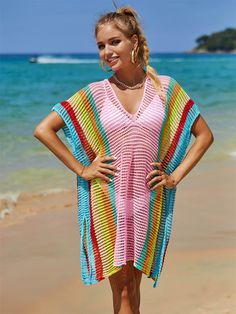 This oversized knit sweater is perfect for a day at the beach or a casual night out. With its playful stripes and comfortable fit, you'll feel stylish and relaxed all day long. Made from high-quality materials, this sweater is a must-have for any beach style wardrobe. Size Guide: Model is 5’8” tall, and has a 34.2” bust, 24.9”waist, & 37.7” hips. She is wearing a S / US 4 / AU 8. This sweater is true to size. Material: 100% Polyester. Key Features: V-Neckline. Short sleeve. Coverup. Crochet Knit. Side Slits. Not lined. Oversized fit. Maternity friendly. No closures. Care Instructions: Machine wash / Cold hand wash Casual V-neck Sweater For Beach, Casual V-neck Beach Poncho, Trendy Striped Summer Sweater, Trendy Multicolor Beach Cover-up, Multicolor Horizontal Stripe Summer Tops, Relaxed Fit Long Sleeve Vacation Sweater, Relaxed Fit Long Sleeve Sweater For Vacation, Striped Ribbed Tops For Beach, Beach Striped Knit Sweater