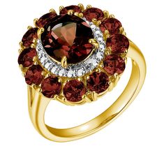 a gold ring with red and white stones on it's center, surrounded by two rows of diamonds