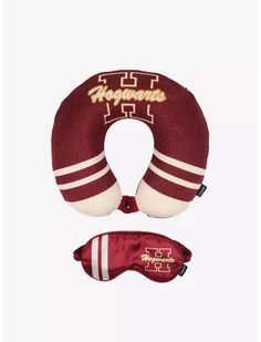 a maroon and white neck pillow with the word arizona in gold on it, next to a