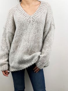 "Oversized casual v-neck pullover sweater give you super warm and stylish looking! Features: * oversized looking * drop-shoulder sleeves * 70% mohair/ 30% acrylic mixed blended color yarn - soft and comfy. Size: S/M (us 2-8) L/XL(us 10-16). Measurements: Size S/M: Chest - 51\"(130cm) Length - 28\" (75cm) Size L/XL: Chest - 55\"(140cm) Length - 30\" (80cm) Pls. see options for different colors. If you want it in different measurements, pls. leave the note or convo me. Hand wash in cold water and Oversized Knitted V-neck Sweater, Cozy Chunky Knit V-neck Sweater, Cozy Oversized Knitted V-neck Sweater, Oversized V-neck Chunky Knit Sweater, Oversized Chunky Knit V-neck Sweater, Oversized Solid Color Casual V-neck Sweater, Knitted Acrylic V-neck Sweater, Oversized Solid V-neck Soft Knit Sweater, Gray Oversized Casual V-neck Sweater