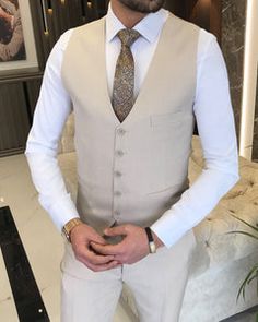 Elegant Beige Notch Lapel Vest, Elegant Beige Vest With Notch Lapel, White Sleeveless Formal Suit, Tailored White Vest For Semi-formal Occasions, Elegant Beige Vest For Semi-formal Occasions, Fitted Beige Business Vest, Fitted Beige Vest For Business, Sleeveless Beige Business Vest, Sleeveless Beige Outerwear For Business