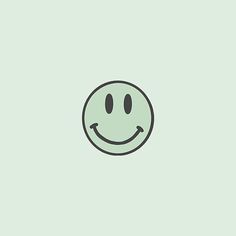 a green smiley face on a light green background