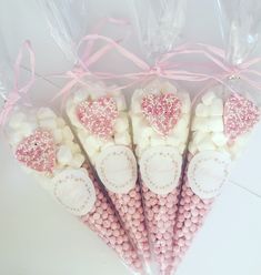 pink and white candy sticks with hearts on them