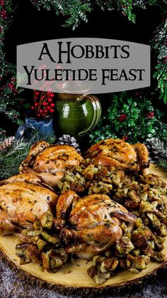 a plate full of chicken and vegetables with the words, hobbits yuletide feast