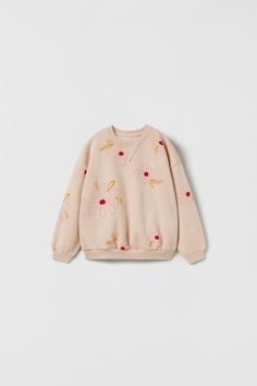 FLORAL SWEATSHIRT - Faded pink | ZARA United States Pink Sweatshirt With Ribbed Collar For Spring, Spring Cream Cotton Sweatshirt, Cute Floral Embroidery Fall Tops, Beige Ribbed Cuff Sweatshirt For Spring, Beige Sweatshirt With Ribbed Cuffs For Spring, Cream Sweatshirt With Ribbed Collar For Spring, Spring Cotton Sweater With Floral Applique, Pink Long Sleeve Sweatshirt With Floral Embroidery, Long Sleeve Sweatshirt With Ribbed Cuffs For Spring