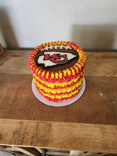 a decorated cake on top of a wooden table