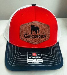 a red, white and blue hat with the word georgia on it