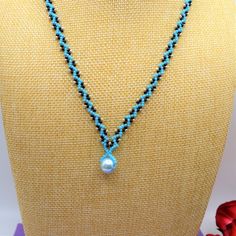 This beaded classy pearl necklace is perfect for brightening up any outfit! Each necklace includes a 5 cm extender chain, adding 2 more inches to the original length. If you would like a different length or color, feel free to send me a message. Turquoise Beaded Necklace With Pearl Charm As Gift, Turquoise Pearl Pendant Necklace As Gift, Blue Beaded Necklaces With Pearl Pendant, Blue Beaded Necklace With Pearl Pendant, Blue Pearl Necklace With Round Beads Pendant, Turquoise Beaded Necklaces With Pearl Chain As Gift, Turquoise Necklaces With Pearl Chain And Round Beads, Turquoise Necklace With Pearl Chain And Round Beads, Turquoise Pearl Necklace With Pearl Drop