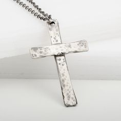 Capture the perfect balance of vintage style and meaningful symbolism with this handmade Cross Tradition pendant necklace in sterling silver. With it's hand hammered patina and traditional look, this cross necklace is a beautiful sentiment of faith, love, and family bonds. Great for gifting to friends or family, it's the perfect way to show that special someone your love. Handmade Antique Silver Cross Necklace, Hand Forged Silver Cross Pendant Necklace, Hand Forged Silver Cross Necklace, Spiritual Silver Cross Necklace With Oxidized Finish, Antique Silver Cross Necklace With Oxidized Finish, Antique Silver Oxidized Cross Necklace, Sterling Silver Oxidized Crucifix Necklace, Antique Silver Cross Necklace Spiritual Style, Hammered Cross Pendant Necklace For Gift