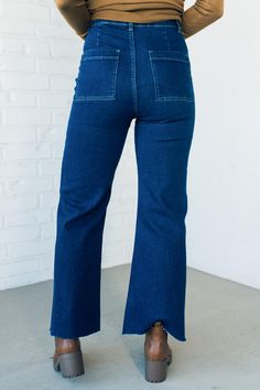 The Greta High Rise Wide Leg Denim offer a flattering fit and timeless style. Crafted from a stretchy material with an ultra high waist, slim cut, and wide leg, these pants provide a comfortable fit and chic silhouette. Features include belt loops and a classic blue finish. 97% Cotton 3% Spandex Ultra High Rise Lightweight Stretch Fit Pleated back waistline Scissor Cut Hem Belt Loops No Side Pockets Patch Back Pockets SIZE GUIDE & MEASUREMENTS: Model is 5'4" wears a size 3/5 and modeling the siz Versatile High-waist Denim Wide Leg Pants, Blue Stretch Wide-leg Jeans, Non-stretch Wide-leg Denim Pants, High-rise Blue Denim Wide Leg Pants, Mid-rise Denim Wide Leg Pants With Belt Loops, Scissor Cut, Wide Leg Denim, Classic Blue, Stretchy Material