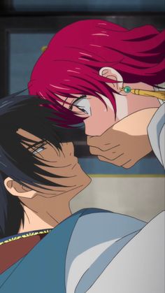 two anime characters are kissing each other