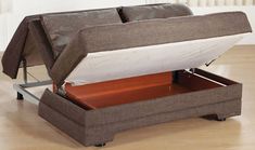 a bed with a storage compartment underneath it