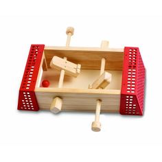 a wooden toy boat with two paddles in it