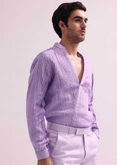 Elevate your evening ensemble with our expertly crafted three-piece tuxedo set. Crafted on a glamorous shimmer base. This lavender tuxedo is ornate with hand embroidered cutdana work and lapel detailing. Complemented with a pleated shirt and straight pants. This glitzy outfit will command everyone's attention. Dry-clean only if required. Slight variation in color is possible due to digital photography. Luxury Fitted Summer Sets, Luxury Fitted Sets For Summer, Fitted Purple Tuxedo For Party, Fitted Purple Tuxedo For Semi-formal Occasions, Fitted Purple Tuxedo For Semi-formal Events, Tailored Purple Set For Party, Tailored Purple Party Sets, Elegant Fitted Summer Tuxedo, Purple Tailored Tuxedo For Party