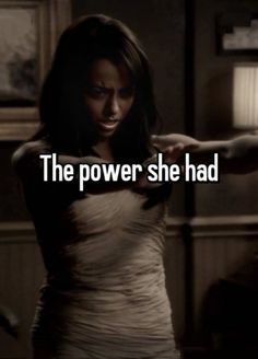 a woman in a dress pointing at something with the caption'the power she had '