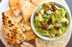 guacamole and tortilla chips on a plate