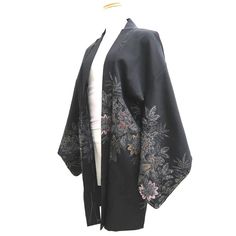 This is a pre-owned authentic Japanese kimono garment. This is a very attractive genuine Japanese Vintage Silk (Lining is Synthetic) Haori. The fabric is a mid-weight Silk, smooth-textured with a lustrous finish typical rinzu fabric. This garment would be great for a special party or for special event, or even for a gorgeous wall art. This kimono has "Shitsuke-ito"(white stitching), to keep garment neat during long periods of storage, it just gets pulled out prior to wearing. #1 Total Length : 80cm/31.5 inches #2 Center to the edge of the sleeve : 63cm/24.8inches #3 Center to Shoulder : 30cm/11.8inches #4 Sleeve Length : 46cm/18.1inches Material: Silk (Lining is Synthetic) Color: Black Silver Gold -Important Notice- All items in my store are used and vintage items. These are not like new m Black Kimono With Floral Embroidery For Fall, Vintage Black Kimono For Spring, Black Floral Embroidered Kimono For Fall, Vintage Black Outerwear With Kimono Sleeves, Japanese Haori Outfit, Haori Women, Traditional Black Kimono With Floral Print, Haori Flower Pattern, Traditional Black Floral Print Kimono