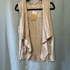 Cute Cover Up/Top/Vest Style. Has A Tie To Close It Or Wear Open. Pockets. Creamy Tan Color. From Magnolia Boutique. Size S. Wrinkly From My Closet. Nwt Beige Vest For Day Out In Spring, Beige Vest For Spring Layering, Trendy Beige Vest For Spring, Spring Sleeveless Neutral Vest, Spring Beige Vest For Layering, Trendy Beige Summer Vest, Pastel Pink Blouse, Green Top Women, Baby Pink Blouse