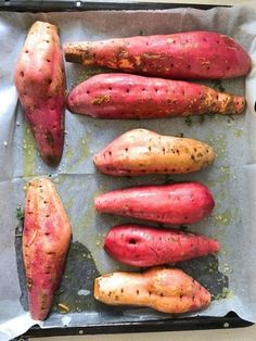 several different types of sweet potatoes on a baking sheet