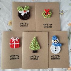 four christmas cards with crocheted snowman, penguin and tree decorations on them