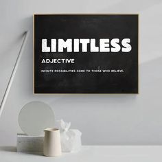 a black and white poster with the words limitless on it next to a mirror