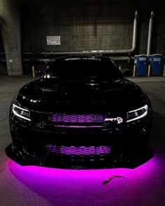 a black car with purple lights on it